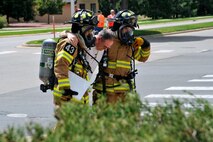 PETERSON AIR FORCE BASE, Colo. – Two 21st Civil Engineer Squadron firefighters assist on a past Condor Crest exercise “victim” from the site of a staged multi-vehicle accident which resulted in a chemical spill. The vehicle accident and resultant chemical spill scenario was the centerpiece of the wing’s four-day Condor Crest exercise. The 21st Space Wing holds Condor Crest exercises throughout the year to evaluate internal processes for effectiveness and efficiency. (Air Force file photo)