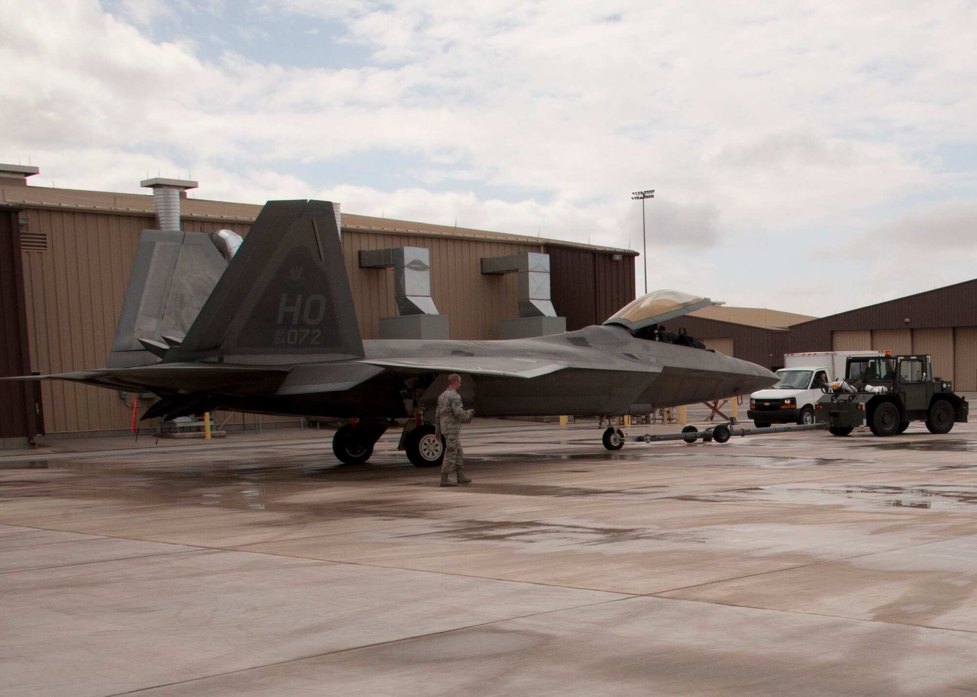 Crew chiefs from the 7th Aircraft Maintenance Unit tow an F-22 Raptor Feb. 17 at Holloman Air Force Base, N.M. To ensure all of Holloman’s F-22s are operationally ready at a moment’s notice, 7th AMU crew chiefs routinely work 12 or more hour shifts fixing, maintaining or prepping the aircraft. (U.S. Air Force photo by Airman 1st Class Siuta B. Ika/Released)