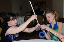 JACKSONVILLE, Fla—U.S. Air Force Reserve Staff Sgt. Marie Anthony, a
medical technician with the 910th Medical Squadron, assits13-year old Lexi
Curry on a group project at the Yellow Ribbon Reintegration Program (YRRP)
held at the Jacksonville Wyndham Hotel Feb. 19. Anthony along with 13 other
Citizen Airmen from the 910th Airlift Wing, volunteered to support the
event.  The YRRP is a DoD-wide effort to promote the well-being of National
Guard and Reserve members, their families and communities, by connecting
them with resources throughout the deployment cycle. Through these events,
service members and loved ones connect with local resources before, during,
and after deployments. For more information about the Yellow Ribbon
Reintegration Program visit www.yellowribbon.mil. 
U.S. Air Force Photo by Master Sgt. Peter Borys
