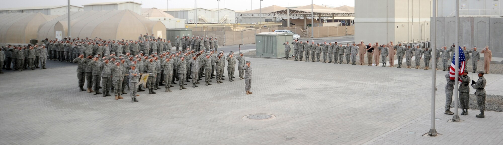 SOUTHWEST ASIA - Airmen and Soldiers assigned to the 380th Air Expeditionary Wing participate in a formal retreat ceremony Feb. 17, 2012. Hundreds of Airmen and Soldiers assigned to the wing gather every Friday afternoon for the event. Each week, a different unit leads the mass formation. (U.S. Air Force photo/Staff Sgt. J.G. Buzanowski)
