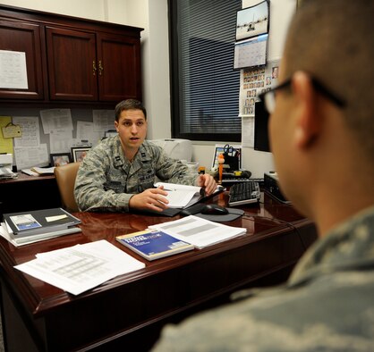 WHITEMAN AIR FORCE BASE, Mo. -- Capt. Michael Pierson, 509th Bomb Wing staff judge advocate chief of military justice, advises an Airman about his issues here Feb. 3. Military justice handles a wide variety of legal issues in real-world experience in the practice of law. The legal issues they encounter are wide-ranging, including criminal, government contract, labor, international, environment and real property laws. (U.S. Air Force photo by Staff Sgt. Alexandra M. Boutte) (RELEASED)