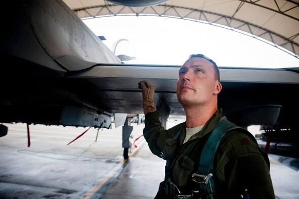 U.S. Air Force Maj. Matthew Clausen, 23d Fighter Group -10C Thunderbolt II pilot, conducts a pre-flight inspection of an A-10 during an operational readiness exercise Feb. 16, 2012, at Moody Air Force Base, Ga. The inspection was Clausen's last chance to recognize any safety hazards or discrepancies with the aircraft before takeoff. (U.S. Air Force photo by Staff Sgt. Jamal D. Sutter/Released) 