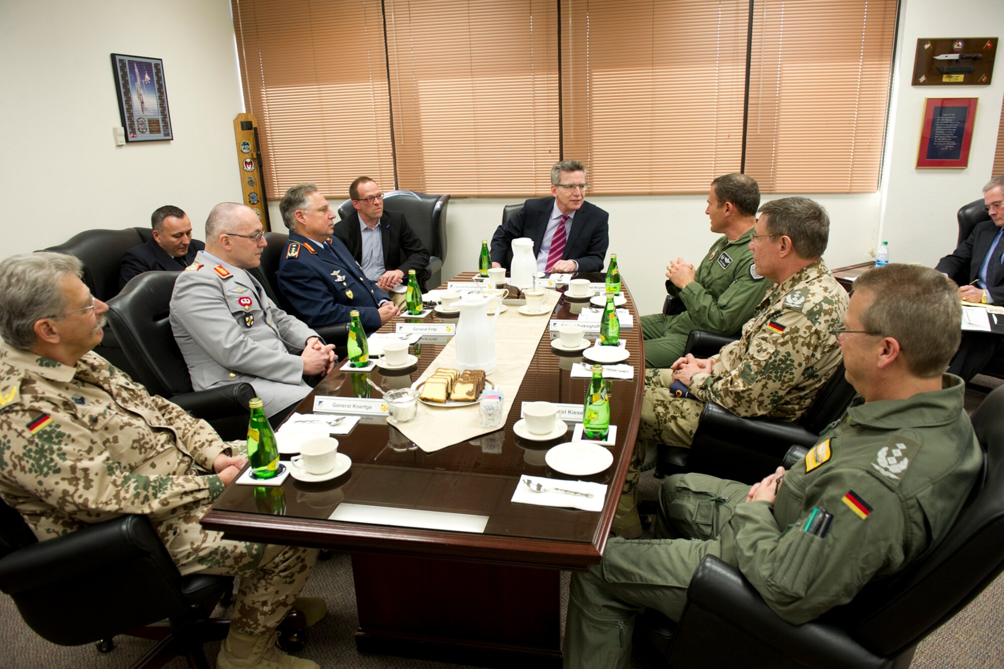 Dr. Thomas de Maiziere (center), the Germany Federal Minister of Defense, meets with U.S. Air Force Col. David Krumm (right of de Maiziere), the 49th Wing commander, and German military officials at Holloman Air Force Base, N.M., Feb. 15, 2012. The minister and 18 German and international media representatives received a first-hand look at the German Air Force Training Center during their visit. The German Air Force began flight training at the base in 1992. (U.S. Air Force photo/Senior Airman DeAndre Curtiss)