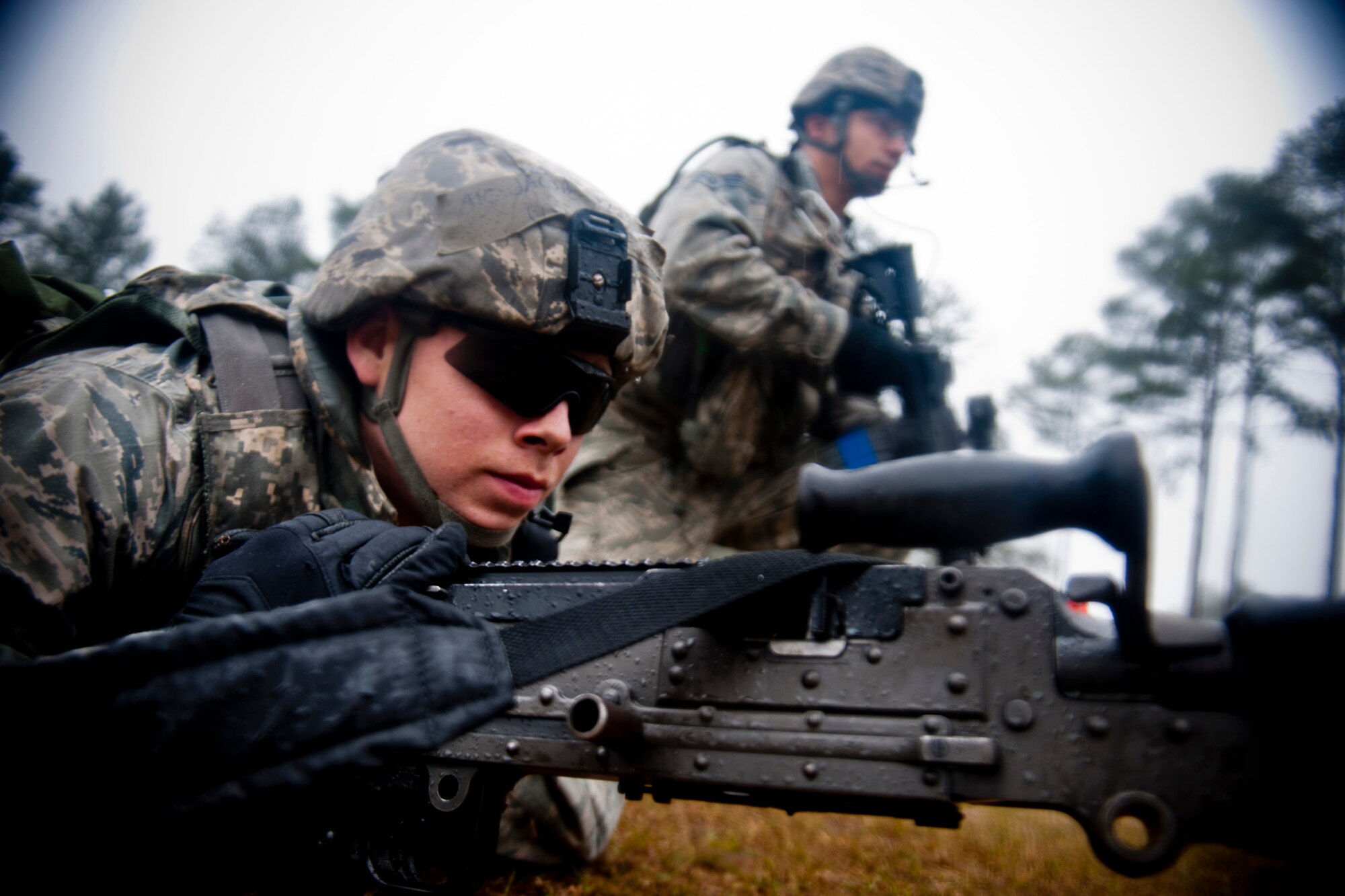 U.S. Air Force Airman 1st Class Jason Haskins and Senior Airman Gregory Walker, 23d Security Forces Squadron patrolmen, participate in a combat patrol rehearsal during an operational readiness exercise Feb. 16, 2012, at Moody Air Force Base, Ga. The unit conducted the rehearsal so each member understood their roles and responsibilities during an actual patrol. During the session, they trained on formations, tactics and various fighting positions used to complete their missions. (U.S. Air Force photo by Staff Sgt. Jamal D. Sutter/Released) 