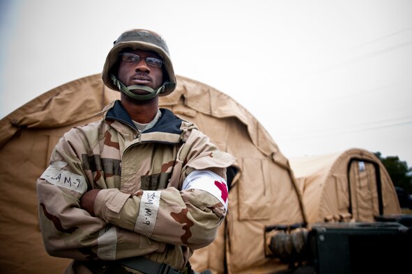 U.S. Air Force Senior Airman Shamarcles Williams, 23d Medical Group medical technician, poses for a photo outside the deployed medical facility during an operational readiness exercise Feb. 15, 2012, at Moody Air Force Base, Ga. Williams is from Linden, Ala., and said he enjoys his current job but hopes to become commissioned as a nurse in the Air Force one day. During the exercise, he helped provide medical care and treatment to simulated victims of various injuries, attacks and illnesses. (U.S. Air Force photo by Staff. Sgt. Jamal D. Sutter/Released) 