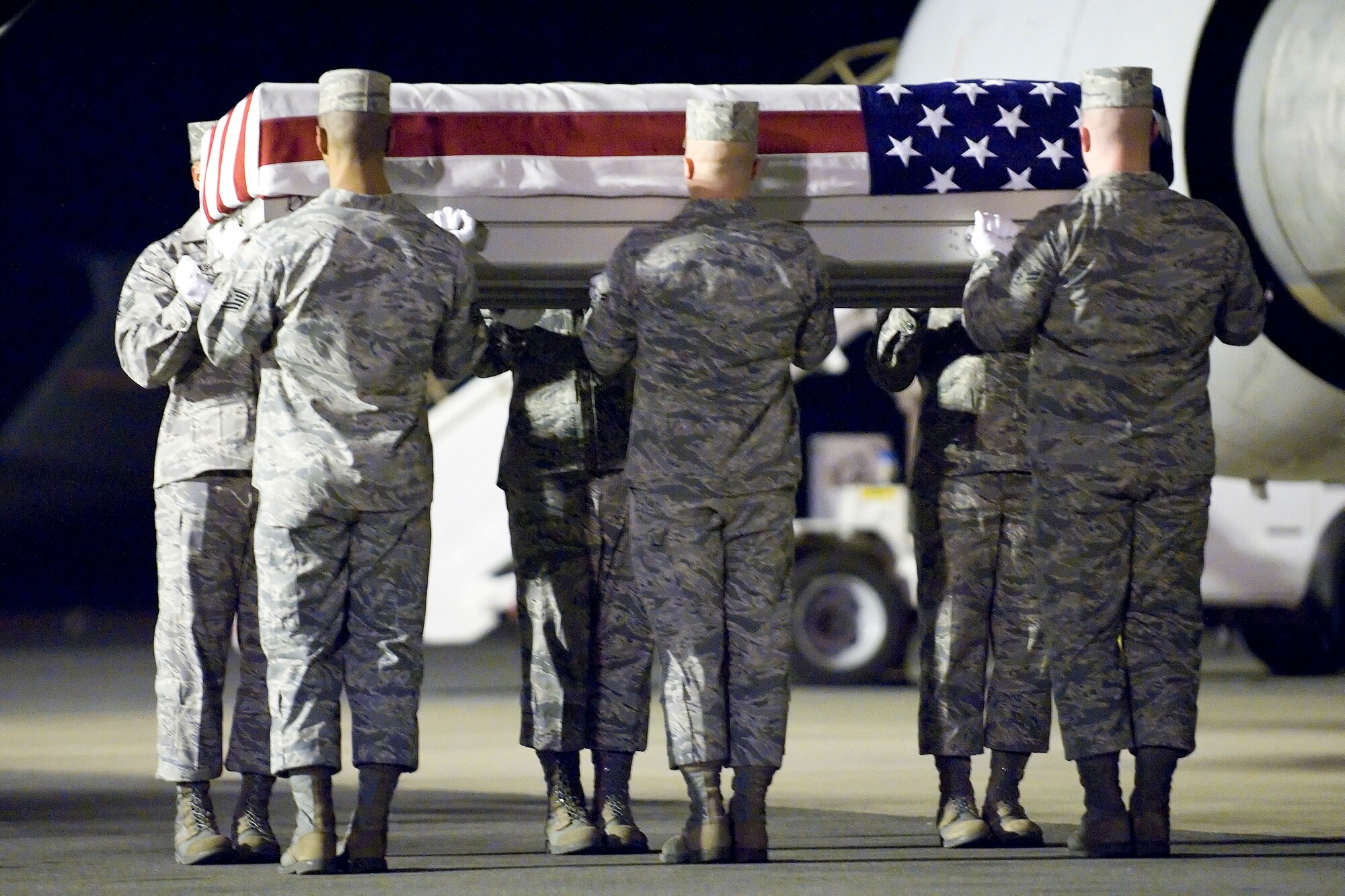 A U.S. Air Force carry team transfers the remains of Air Force Capt. Nicholas S. Whitlock of Newnan, Ga., at Dover Air Force Base, Del., Feb. 21, 2012. Whitlock was assigned to the 34th Special Operations Squadron, Hurlburt Field, Fla. (U.S. Air Force photo/Adrian R. Rowan)
