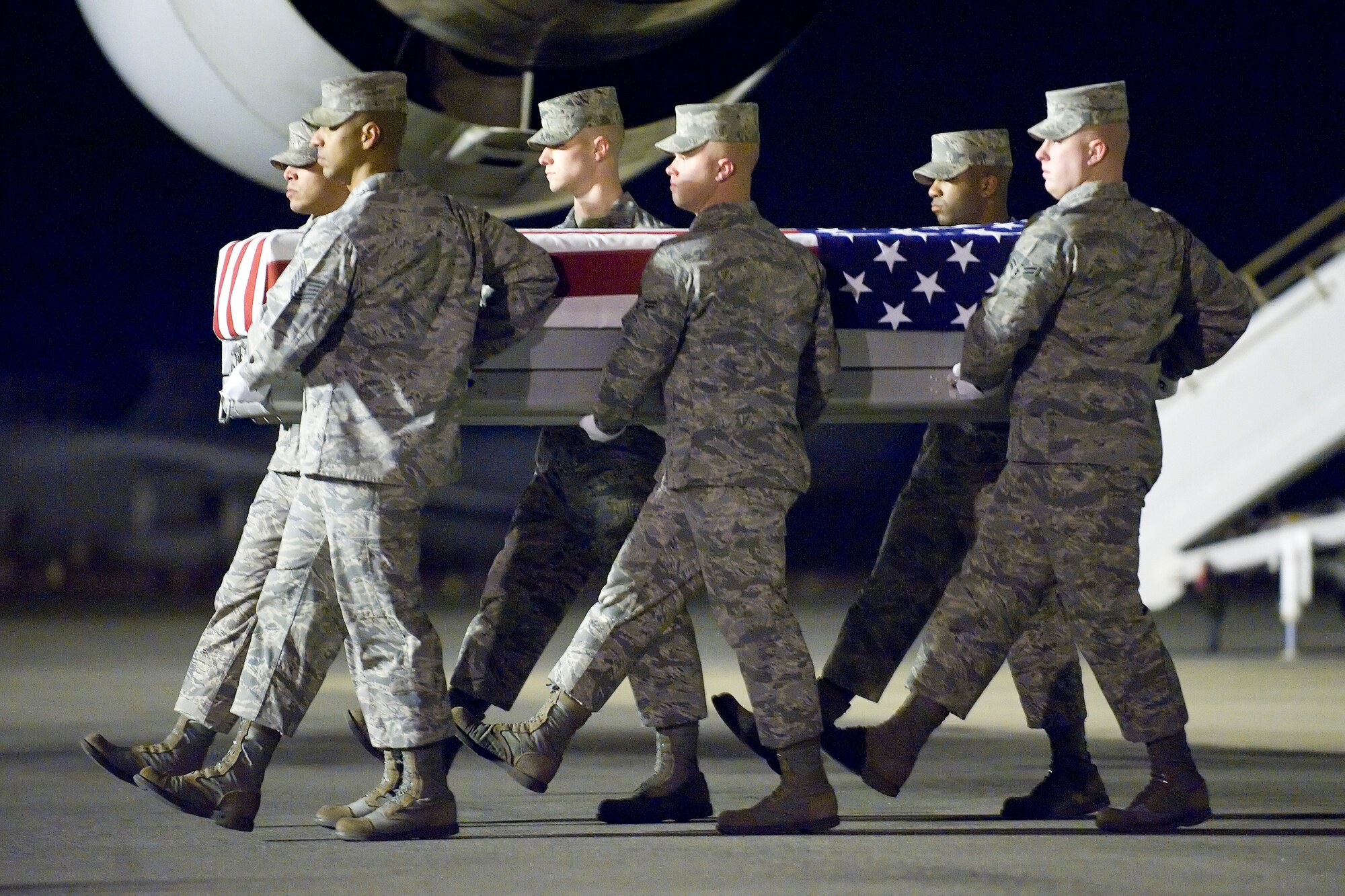 A U.S. Air Force carry team transfers the remains of Air Force Capt. Ryan P. Hall of Colorado Springs, Colo., at Dover Air Force Base, Del., Feb. 21, 2012. Hall was assigned to the 319th Special Operations Squadron, Hurlburt Field, Fla. (U.S. Air Force photo/Adrian R. Rowan)
