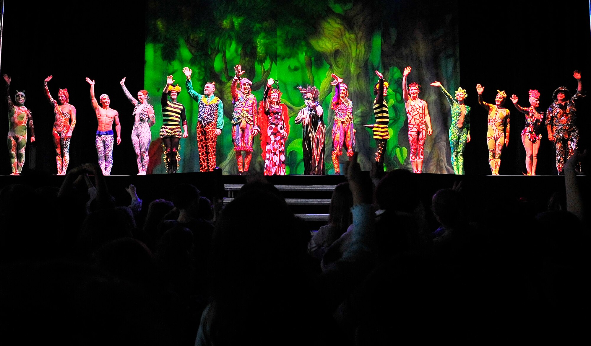 Members of Team Ramstein waited an hour in the cold for a warm seat to view Cirque Dreams "Jungle Fantasy” World Tour performance at Ramstein Air Base, Germany, Feb. 17, 2012.  The hour and a half show featured vibrant costumes, amazing acts of physical strength and skill, aerial acts, tumblers, jugglers, gymnasts, contortionists and jokesters. Cirque Dreams partnered with Armed Forces Entertainment to perform "Jungle Fantasy" at 17 military installations in 10 different countries through Asia and Europe.  (U.S. Air Force Photo by/ Staff Sgt. Daylena Gonzalez)