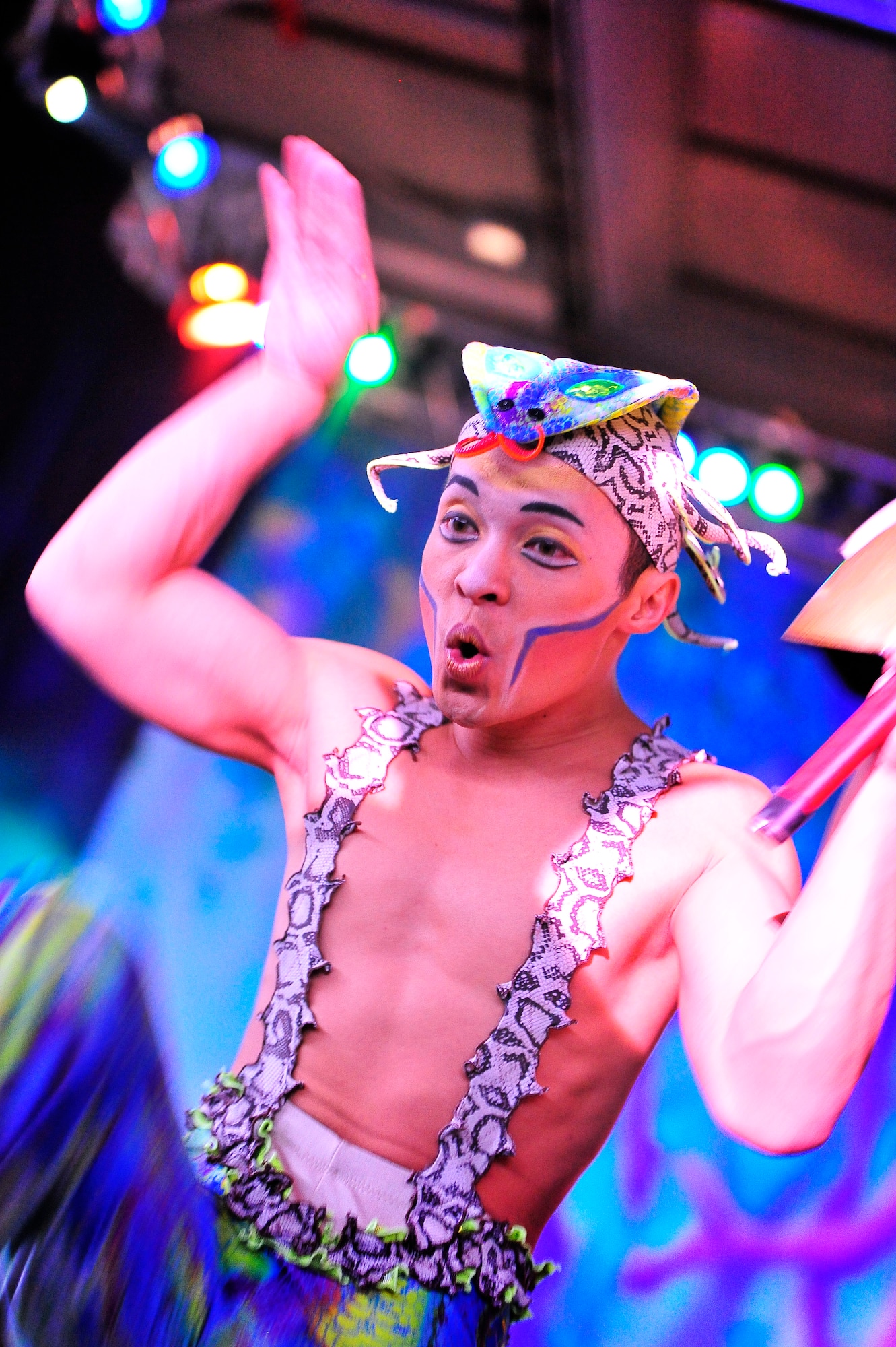 Members of Team Ramstein waited an hour in the cold for a warm seat to view Cirque Dreams "Jungle Fantasy” World Tour performance at Ramstein Air Base, Germany, Feb. 17, 2012.  The hour and a half show featured vibrant costumes, amazing acts of physical strength and skill, aerial acts, tumblers, jugglers, gymnasts, contortionists and jokesters. Cirque Dreams partnered with Armed Forces Entertainment to perform "Jungle Fantasy" at 17 military installations in 10 different countries through Asia and Europe.  (U.S. Air Force Photo by/ Staff Sgt. Daylena Gonzalez)