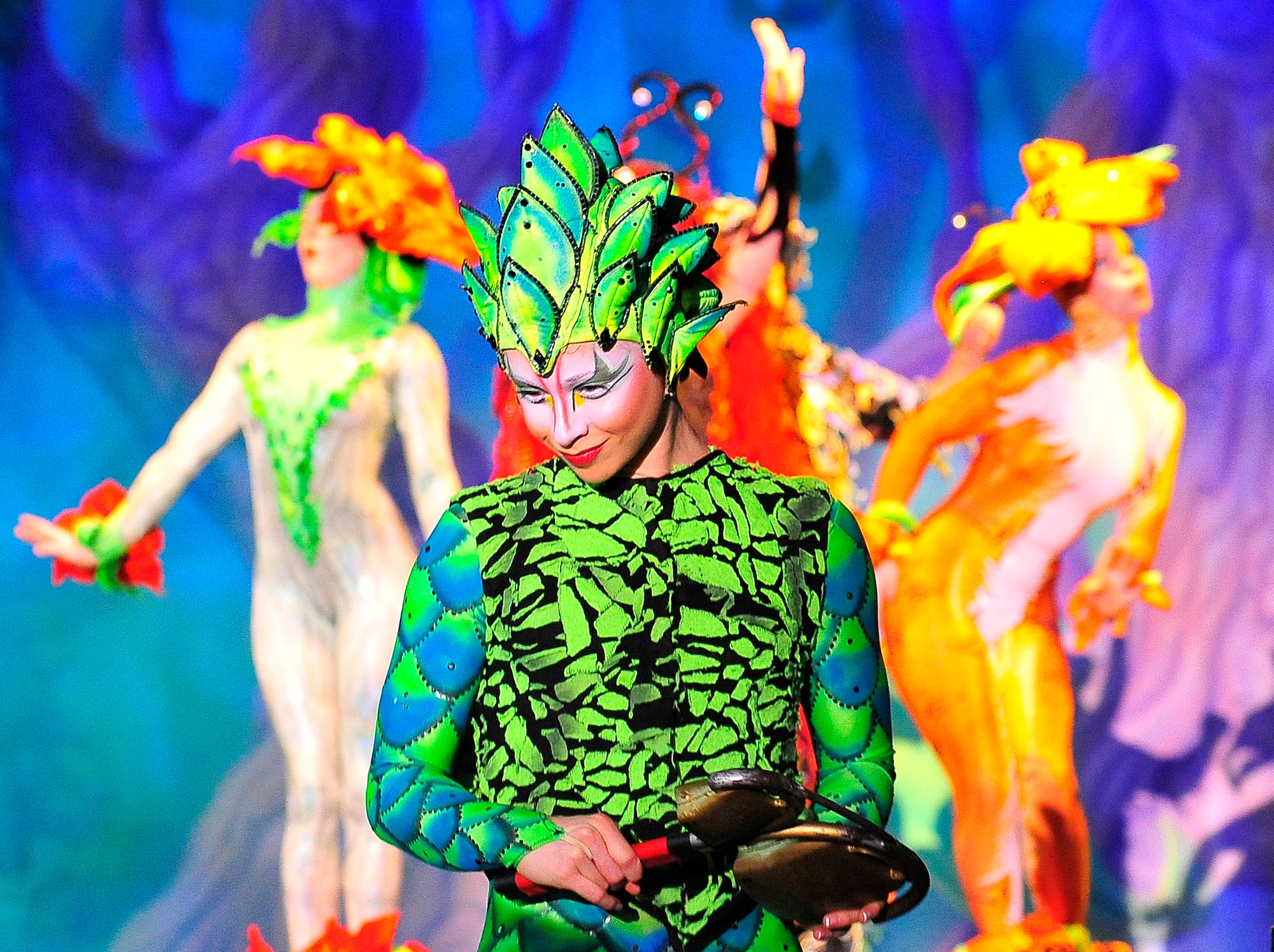 Members of Team Ramstein waited an hour in the cold for a warm seat to view Cirque Dreams "Jungle Fantasy” World Tour performance at Ramstein Air Base, Germany, Feb. 17, 2012.  The hour and a half show featured vibrant costumes, amazing acts of physical strength and skill, aerial acts, tumblers, jugglers, gymnasts, contortionists and jokesters. Cirque Dreams partnered with Armed Forces Entertainment to perform "Jungle Fantasy" at 17 military installations in 10 different countries through Asia and Europe.  (U.S. Air Force Photo by/ Staff Sgt. Daylena Gonzalez)