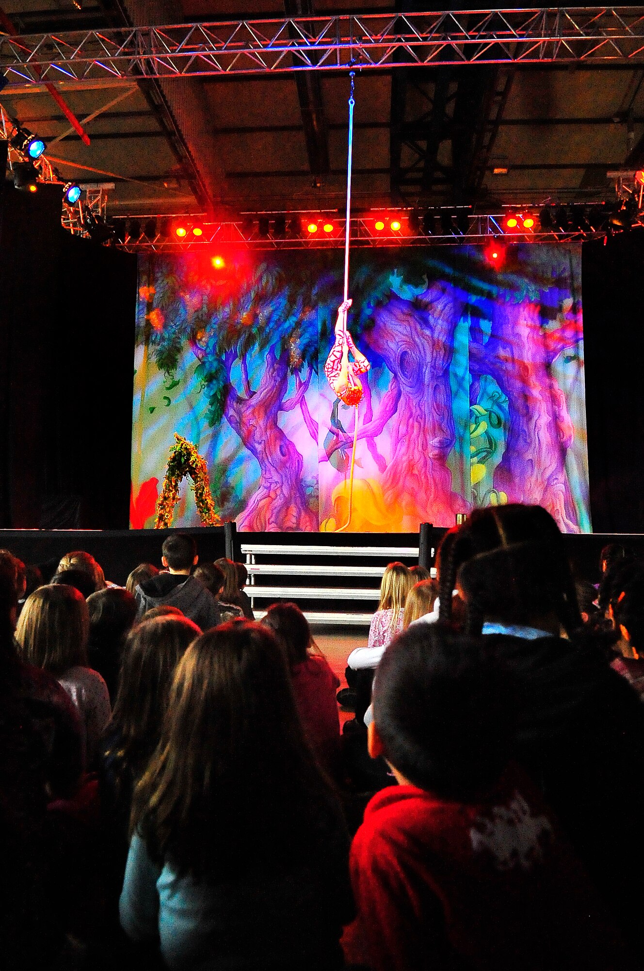 Members of Team Ramstein waited an hour in the cold for a warm seat to view Cirque Dreams "Jungle Fantasy” World Tour performance at Ramstein Air Base, Germany, Feb. 17, 2012.  The hour and a half show featured vibrant costumes, amazing acts of physical strength and skill, aerial acts, tumblers, jugglers, gymnasts, contortionists and jokesters. Cirque Dreams partnered with Armed Forces Entertainment to perform "Jungle Fantasy" at 17 military installations in 10 different countries through Asia and Europe.  (U.S. Air Force Photo by/ Staff Sgt. Daylena Gonzalez)