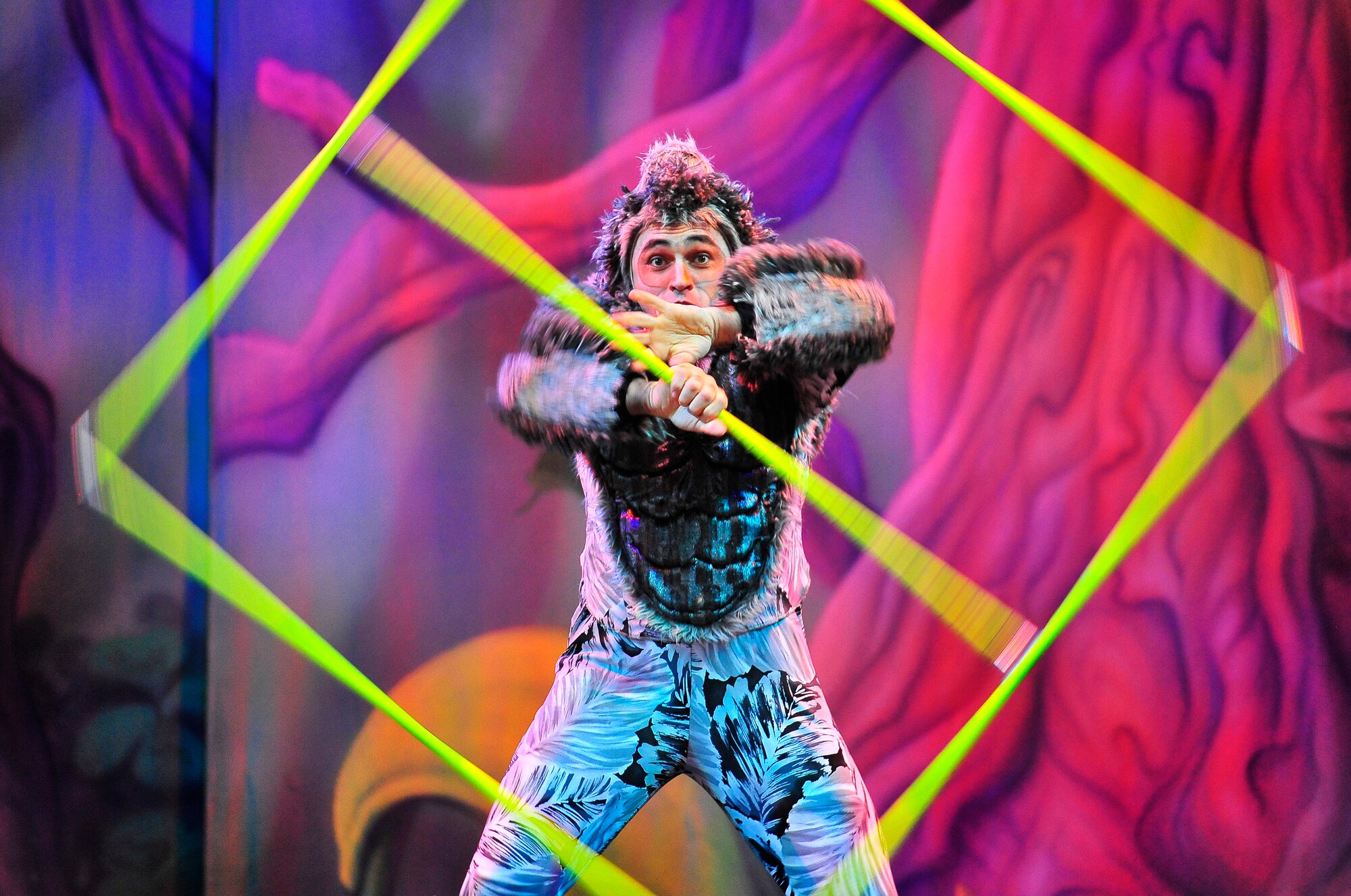 Members of Team Ramstein waited an hour in the cold for a warm seat to view Cirque Dreams "Jungle Fantasy” World Tour performance at Ramstein Air Base, Germany, Feb. 17, 2012.  The hour and a half show featured vibrant costumes, amazing acts of physical strength and skill, aerial acts, tumblers, jugglers, gymnasts, contortionists and jokesters. Cirque Dreams partnered with Armed Forces Entertainment to perform "Jungle Fantasy" at 17 military installations in 10 different countries through Asia and Europe.  (U.S. Air Force Photo by/ Staff Sgt. Daylena Gonzalez)