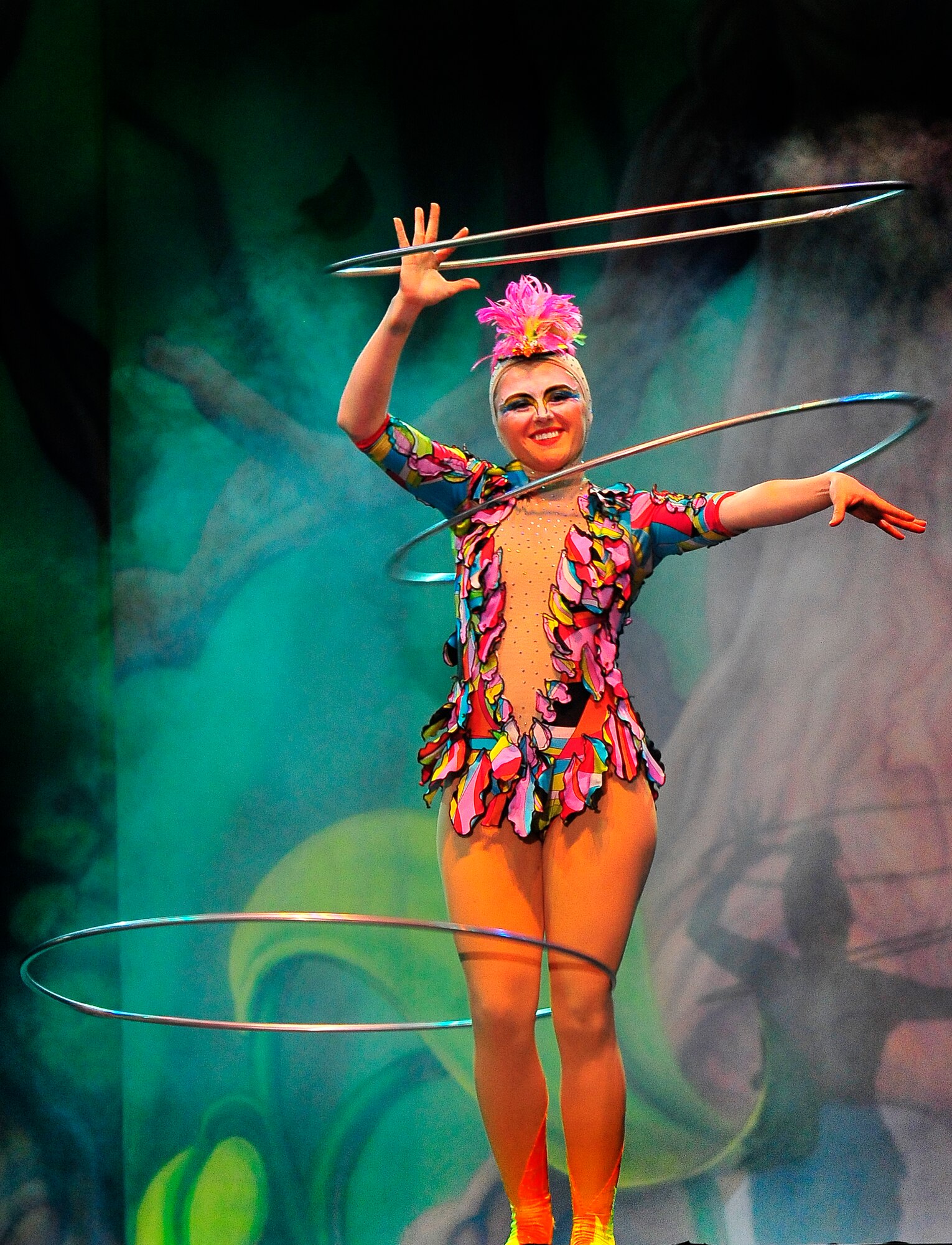 Members of Team Ramstein waited an hour in the cold for a warm seat to view Cirque Dreams "Jungle Fantasy” World Tour performance at Ramstein Air Base, Germany, Feb. 17, 2012.  The hour and a half show featured vibrant costumes, amazing acts of physical strength and skill, aerial acts, tumblers, jugglers, gymnasts, contortionists and jokesters. Cirque Dreams partnered with Armed Forces Entertainment to perform "Jungle Fantasy" at 17 military installations in 10 different countries through Asia and Europe.  (U.S. Air Force Photo by/ Staff Sgt. Daylena Gonzalez)