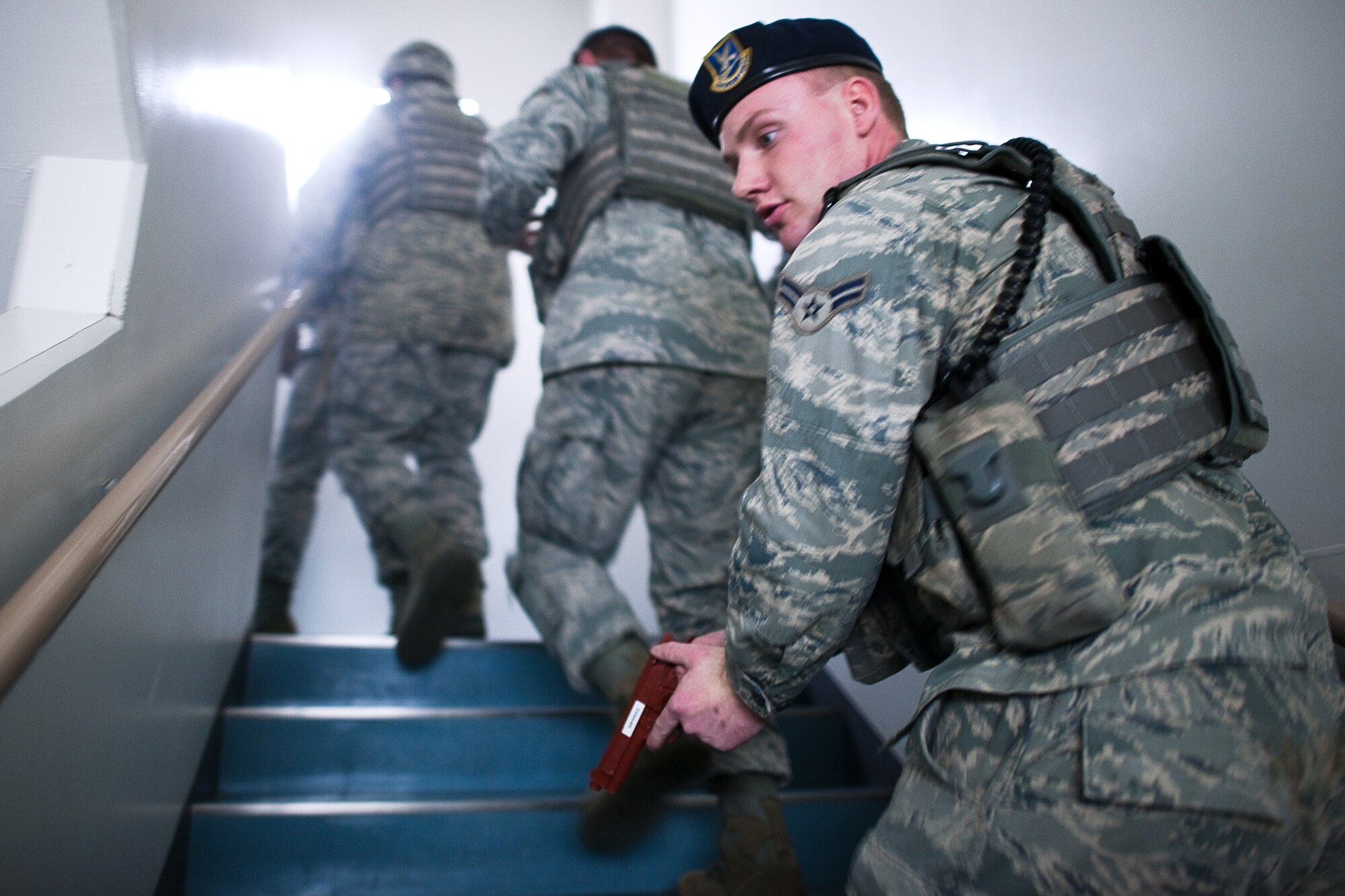 YOKOTA AIR BASE, Japan -- Airman 1st Class Jacob Briscoe, 374th Security Forces Squadron patrolman, watches his wingman's back during an active shooter scenario at Yokota Air Base, Japan, Feb. 21, 2012. Yokota is participating in a week-long exercise to maintain readiness capabilities. (U.S. Air Force photo/Osakabe Yasuo)