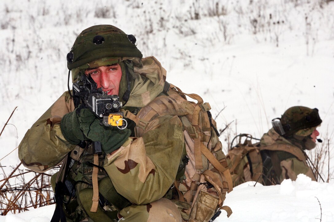 Georgian soldiers keep a watchful eye on the surrounding area after a practice firefight with mock enemy insurgents at the Joint Multinational Readiness Center, Hohenfels, Germany, Feb. 17, 2012.