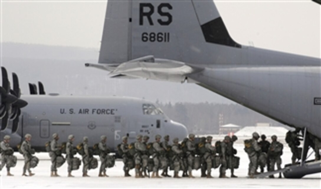 U.S. Army paratroopers from the 173rd Airborne Brigade Combat Team, from Vicenza, Italy, file into a C-130J Super Hercules at Ramstein Air Base, Germany, on Feb. 10, 2012.  More than 300 paratroopers were dropped to commemorate 70 years of combat airlift abilities of the 37th Airlift Squadron from Ramstein Air Base.  