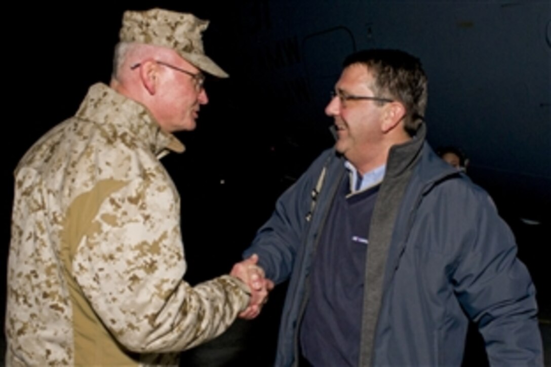 U.S. Marine Corps Maj. Gen. James Laster, left, greets U.S. Deputy Defense Secretary Ashton B. Carter upon his arrival in Kabul, Afghanistan, Feb. 21, 2012. Carter is scheduled to meet with Afghan and International Security Assistance Force leaders and to visit U.S. and coalition forces to convey his thanks for their efforts there.