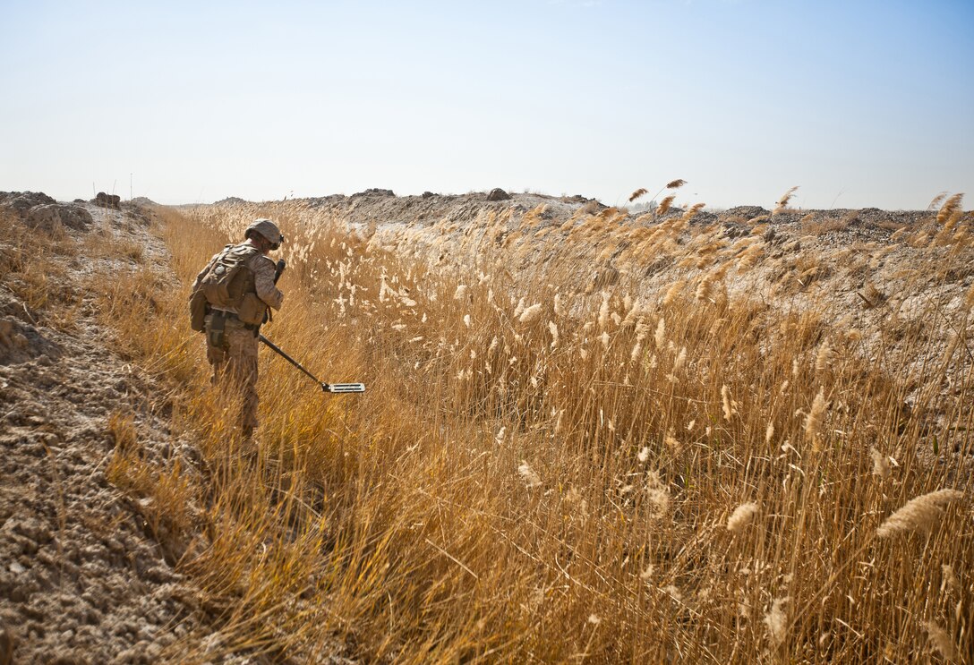 Lance Cpl. Zachary Hadley, a combat engineer with Bridge Platoon, Alpha Company, 9th Engineer Support Battalion and a native of Kansas City, Mo., checks for IED’s (Improvised Explosive Devices) before his platoon can move in and begin construction on a bridge near Combat Outpost Rankel in the district of Garmsir, Helmand province, Jan. 29. The Marines of Bridge Platoon endured a 5-day convoy in order to replace a temporary bridge with a more permanent structure that would increase mobility for Marines operating in the area.