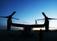 After the flight home, Sgt. Kyle W. Harrison, a Marine Medium Tiltrotor Squadron 365 MV-22B crew chief, performs a post-flight inspection on the Osprey. Marines of VMM-365 returned to their hangar from a training exercise in Belize, Sept. 19.