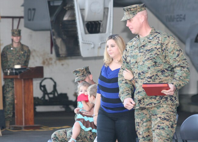 Capt. Thomas Keech, Marine Medium Tiltrotor Squadron 264 pilot, escorts Mary Dudley, the widow of Staff Sgt. Thomas J. Dudley during a ceremony at the VMM-264 hangar, Nov. 7. 
