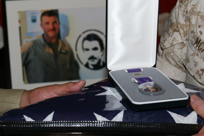Staff Sgt. Thomas J. Dudley's commanding officer thanks his father, Thomas A. Ulmer, for his son's sacrifice in support of Operation Enduring Freedom, after a memorial, Aug. 26.