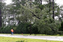 A tree hangs on a power line aboard Marine Corps Air Station New River, N.C., following Hurricane Irene, Aug. 27, 2011. The aftermath of Hurricane Irene left a path of destruction aboard MCAS New River, N.C, and coastal Carolina. 