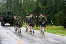 Marines clear debris from roads aboard Marine Corps Air Station New River, N.C. following Hurricane Irene, Aug. 27, 2011. The aftermath of Hurricane Irene left a path of destruction aboard MCAS New River, N.C, and coastal Carolina. 