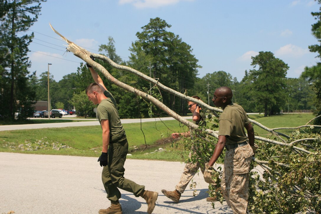 Marines aboard Marine Corps Air Station New River, N.C., help clean up the mess left by Hurricane Irene, Aug. 29. The aftermath of Hurricane Irene, which hit the area Aug. 27, left a path of destruction aboard MCAS New River, N.C, and coastal Carolina.
