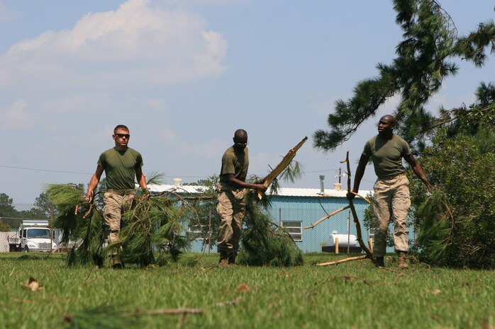Marines aboard Marine Corps Air Station New River, N.C., help clean up the mess left by Hurricane Irene, Aug. 29. The aftermath of Hurricane Irene, which hit the area Aug. 27, left a path of destruction aboard MCAS New River, N.C, and coastal Carolina.
