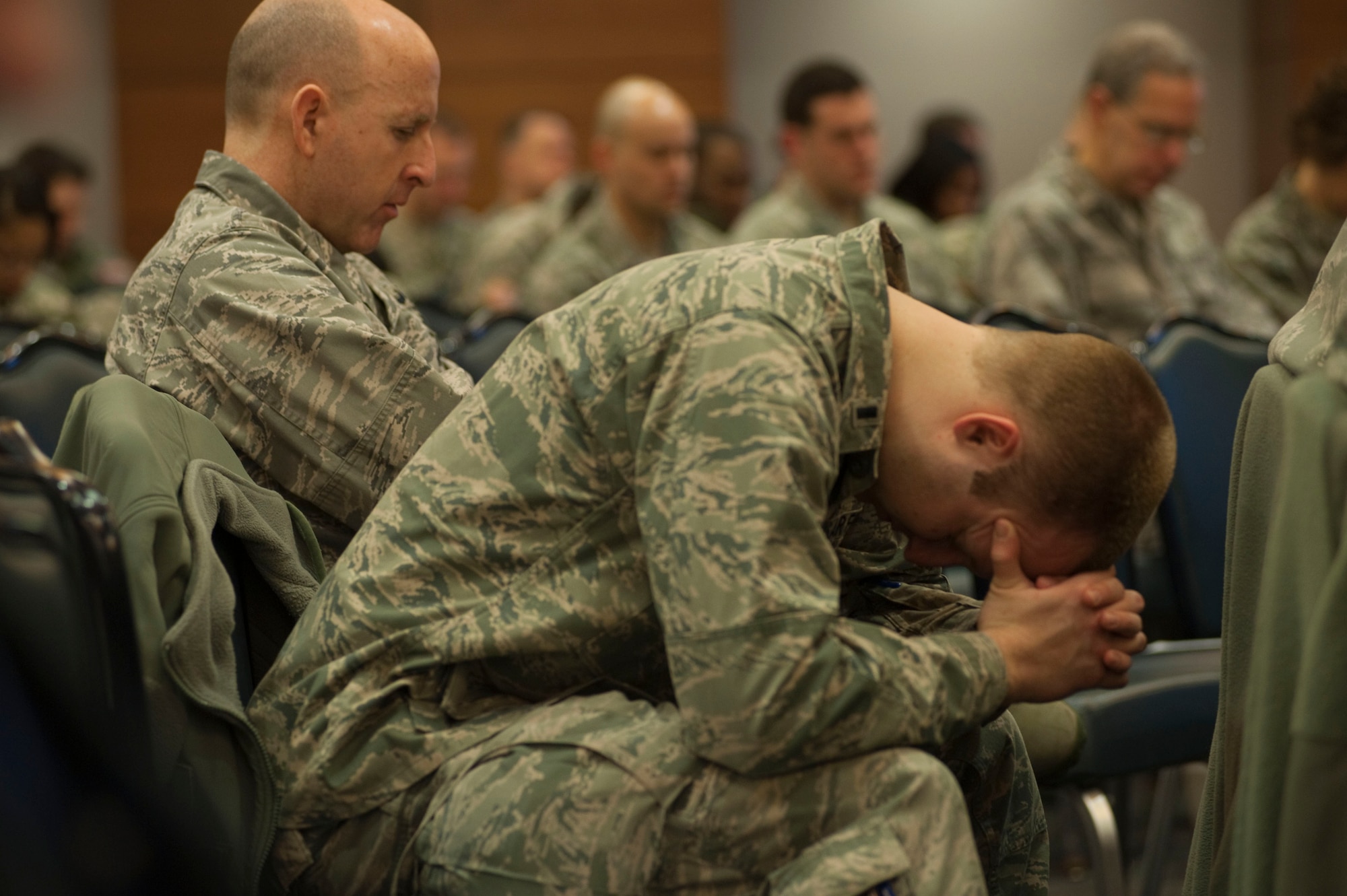Airmen pray during the 2012 National Prayer Breakfast in the Arctic Warrior Event Center, Joint Base Elmendorf-Richardson Feb. 22. The U.S. military regularly participates in this international prayer tradition. Scripture readings were read from multiple sacred writings from diverse religions. The guest speaker for this year's event was Air Force Chaplain (Brig. Gen.) Howard Stendahl, the deputy chief of chaplains and a member of the special staff of the Chief of Staff of the Air Force at the Pentagon. Stendahl spoke on "Resilience in the community of faith". (U.S. Air Force photo/Staff Sgt. Robert Barnett)