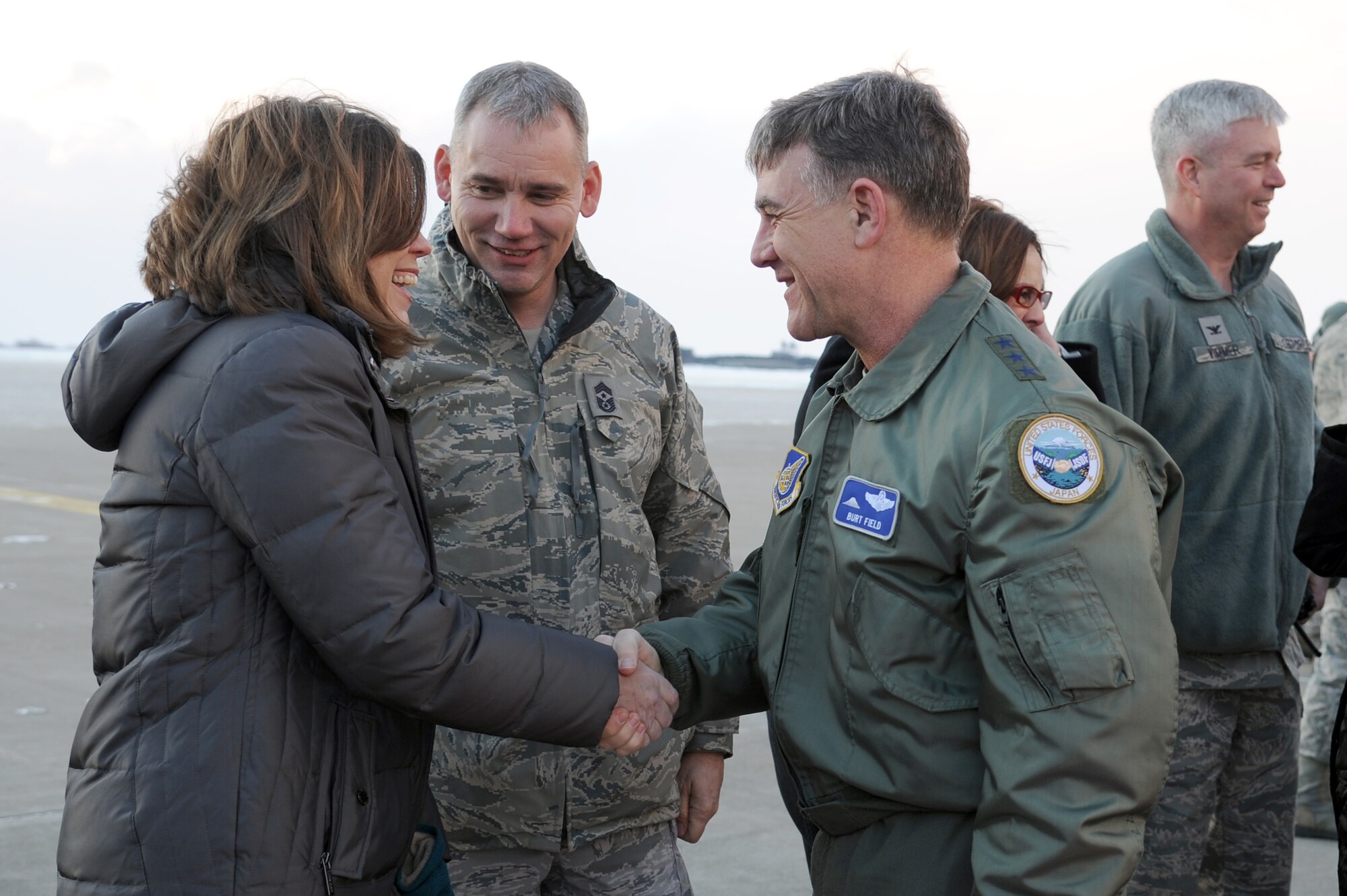 U.S. Air Force Lt. Gen. Burton Field, right, 5th Air Force commander, is greeted by Chief Master Sgt. James Laurent, 35th Fighter Wing command chief, and his wife Terri upon his arrival at Misawa Air Base, Japan Feb. 16, 2012. During their visit, they toured base facilities, visited with Airmen and their spouses and also attended a Japan-America Air Force Goodwill Association award ceremony. (U.S. Air Force photo by Tech. Sgt. Marie Brown/Released)