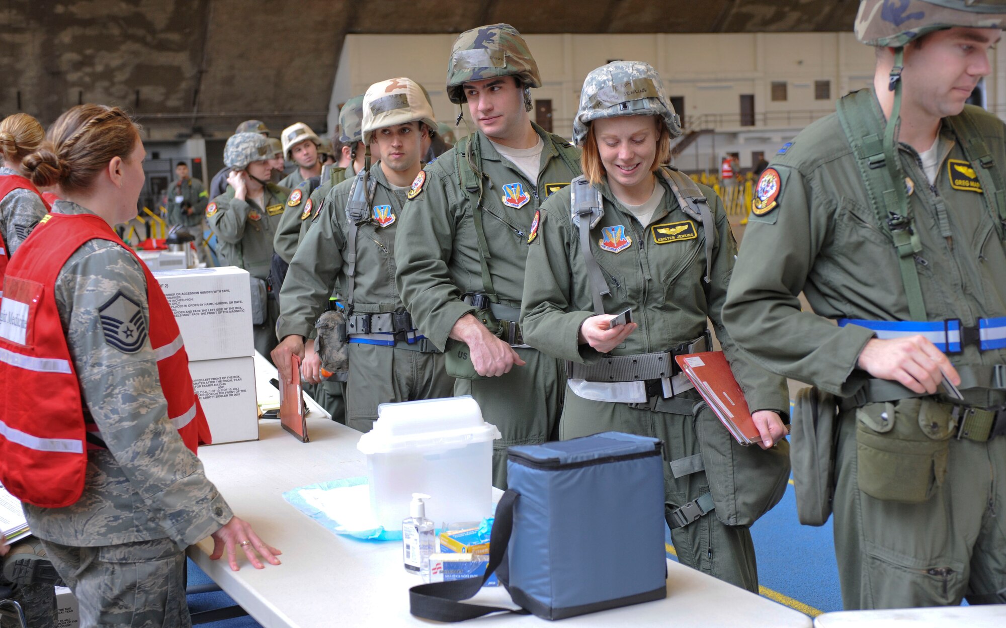 Aircrew from the 37th Bomb Squadron process through a deployment line during an Operational Readiness Exercise in the Pride Hangar at Ellsworth Air Force Base, S.D., Feb. 22, 2012. The Operational Readiness Exercise prepares Airmen to deploy in support of contingency operations in deployed locations.  (U.S. Air Force photo by Airman 1st Class Anania Tekurio/Released)    
