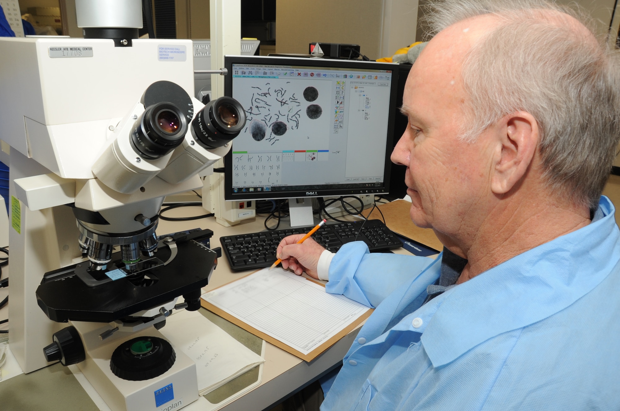 Chris Williams, 81st Medical Operations Squadron cytogenetics technologist, views metaphase under a microscope and logs his findings at the 81st Medical Group’s genetics center at Keesler Air Force Base, Miss., Feb. 17, 2012.  (U.S. Air Force photo by Kemberly Groue)