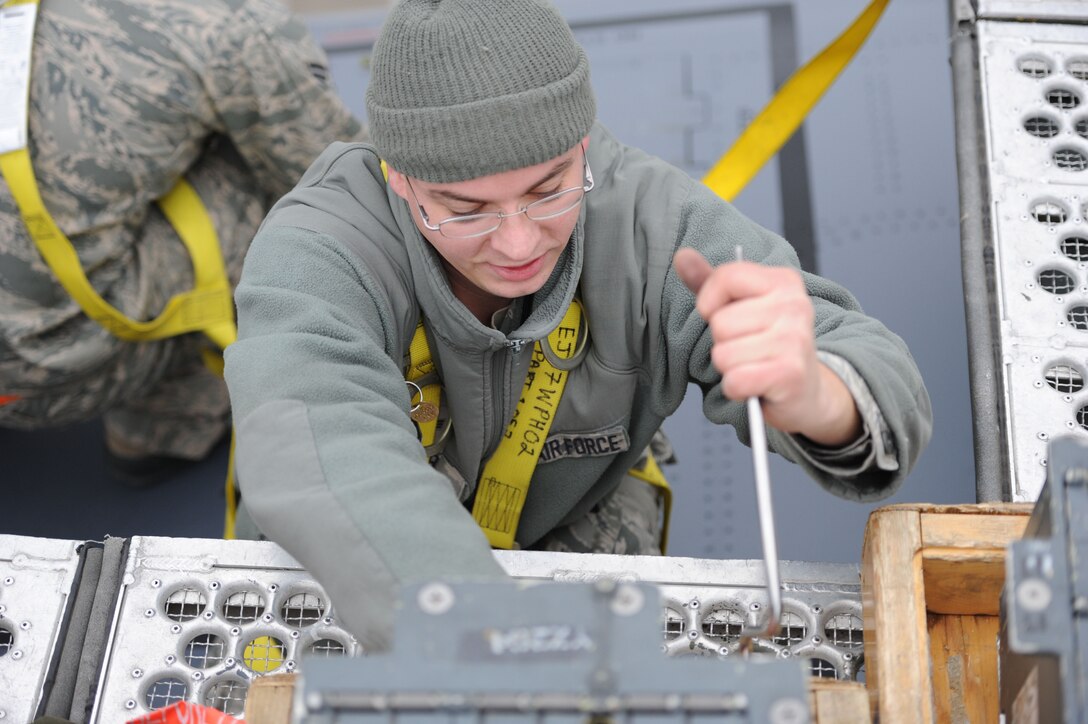 Senior Airman Aaron Webb, 28th Maintenance Group aircraft armament systems specialist, installs flares onto a B-1B during the recent Operational Readiness Exercise at Ellsworth Air Force Base, S.D., Feb. 22, 2012. The ORE, conducted from Feb. 22 to 24, tested the ability of base Airmen to prepare for and respond to real world taskings. (U.S. Air Force photo by Airman Hrair H. Palyan/Released)