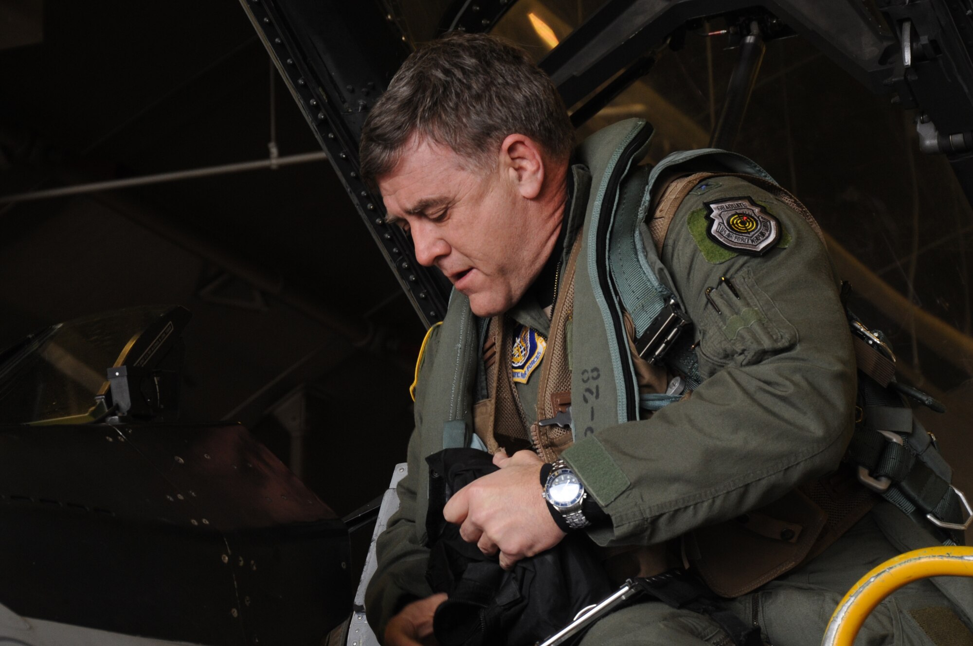 U.S. Air Force Lt. Gen. Burton Field, Fifth Air Force commander, steps into an F-16 Fighting Falcon aircraft during a visit at Misawa Air Base, Japan, Feb.17, 2012. Field was commissioned in 1979 after graduating from the U.S. Air Force Academy. (U.S. Air Force photo by Airman Kenna Jackson/Released)