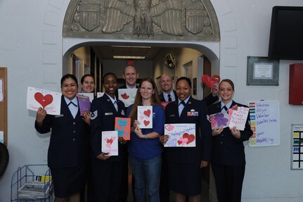 Members of the Joint Base San Antonio-Randolph Rising 5/6 hold up the valentines they collected to take to the Audie L. Murphy Veteran's Hospital in support of Valentine's for Vets, Feb. 17. Children from the JBSA-Randolph Youth Center made a large portion of the valentines, while others were collected from base squadrons.