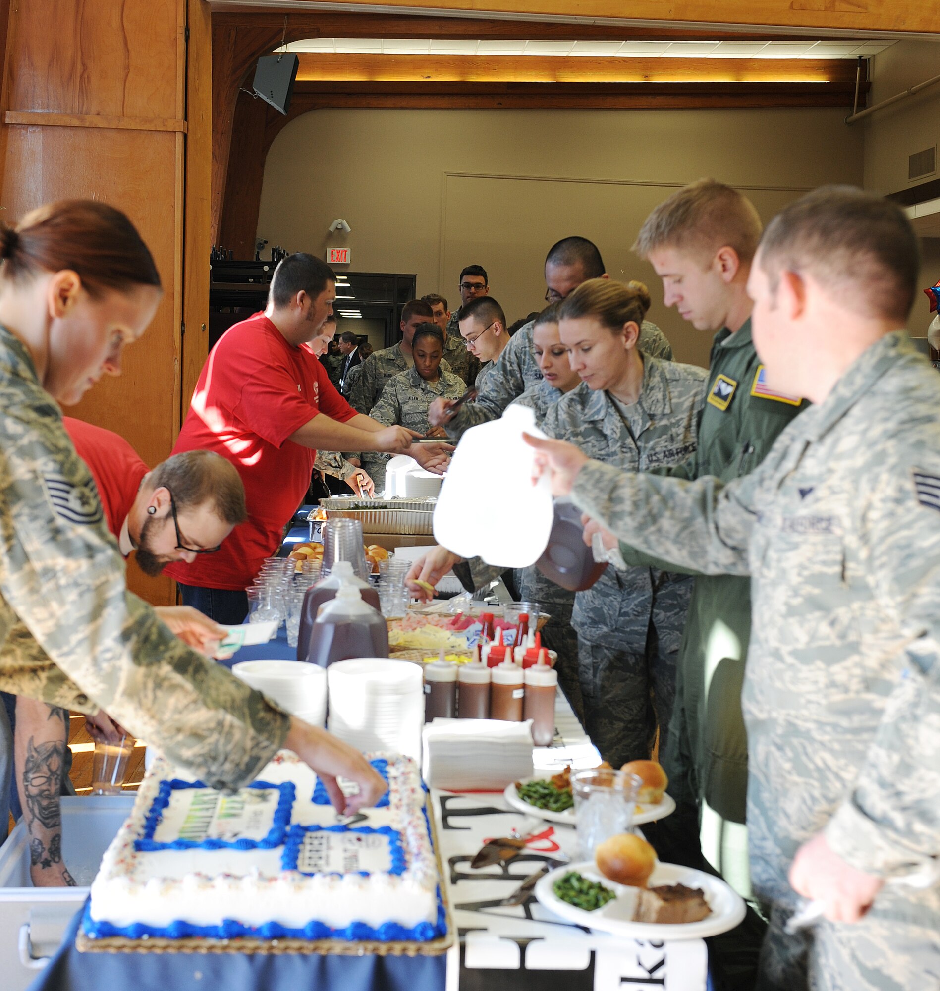 Members of Team Little Rock line up for lunch during the Military Saves Week at the Thomas Community Activity Center, Feb. 21, 2012, at Little Rock Air Force Base, Ark. Personnel from First Arkansas’ Bank and Trust, Arkansas’ Federal Credit Union and the Counseling Services gave advice on understanding credit scores, investing scams, frauds, identity theft and managing your financial future. (U.S. Air Force photo by Airman 1st Class Ellora Remington)
