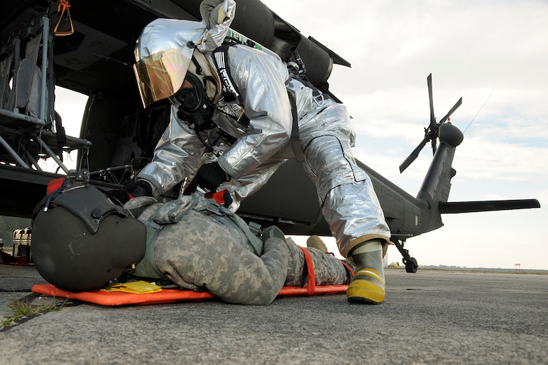 Firefighters with the 169th Civil Engineering Squadron at McEntire Joint National Guard Base, S.C., respond to a simulated aircraft mishap with a crashed F-16 fighter jet and UH-60 Black Hawk helicopter during a Crash, Damaged, Destroyed Aircraft Recovery (CDDAR) exercise on January 31, 2012.  Pilots and crew members were extracted from the Black Hawk by rescue responders and transported to triage area for Emergency Medical Technicians.  The training was important for all personnel involved due to the reality of the scenario, with the base sharing both air frames.
(SCANG photo by TSgt. Caycee Cook)
