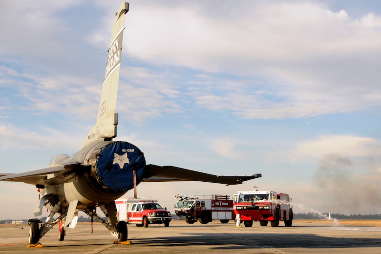 Firefighters with the 169th Civil Engineering Squadron at McEntire Joint National Guard Base, S.C., respond to a simulated aircraft mishap with a crashed F-16 fighter jet and UH-60 Black Hawk helicopter during a Crash, Damaged, Destroyed Aircraft Recovery (CDDAR) exercise on January 31, 2012.  Pilots and crew members were extracted from the Black Hawk by rescue responders and transported to triage area for Emergency Medical Technicians.  The training was important for all personnel involved due to the reality of the scenario, with the base sharing both air frames.
(SCANG photo by TSgt. Caycee Cook)
