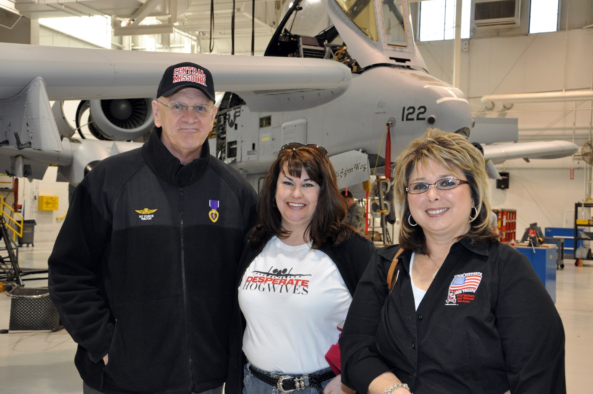 Christine Eckfeld, wife of Gregory Eckfeld, 442nd Fighter Wing vice commander, poses for a photo with University of Central Missouri, Warrensburg, Mo., faculty members. UCM faculty toured the 442nd FW at Whiteman Air Force Base, Mo. Feb. 17, 2012. The 442nd Fighter Wing is an A-10 Thunderbolt II Air Force Reserve unit at Whiteman AFB, Mo. (U.S. Air Force photo/Senior Airman Wesley Wright)