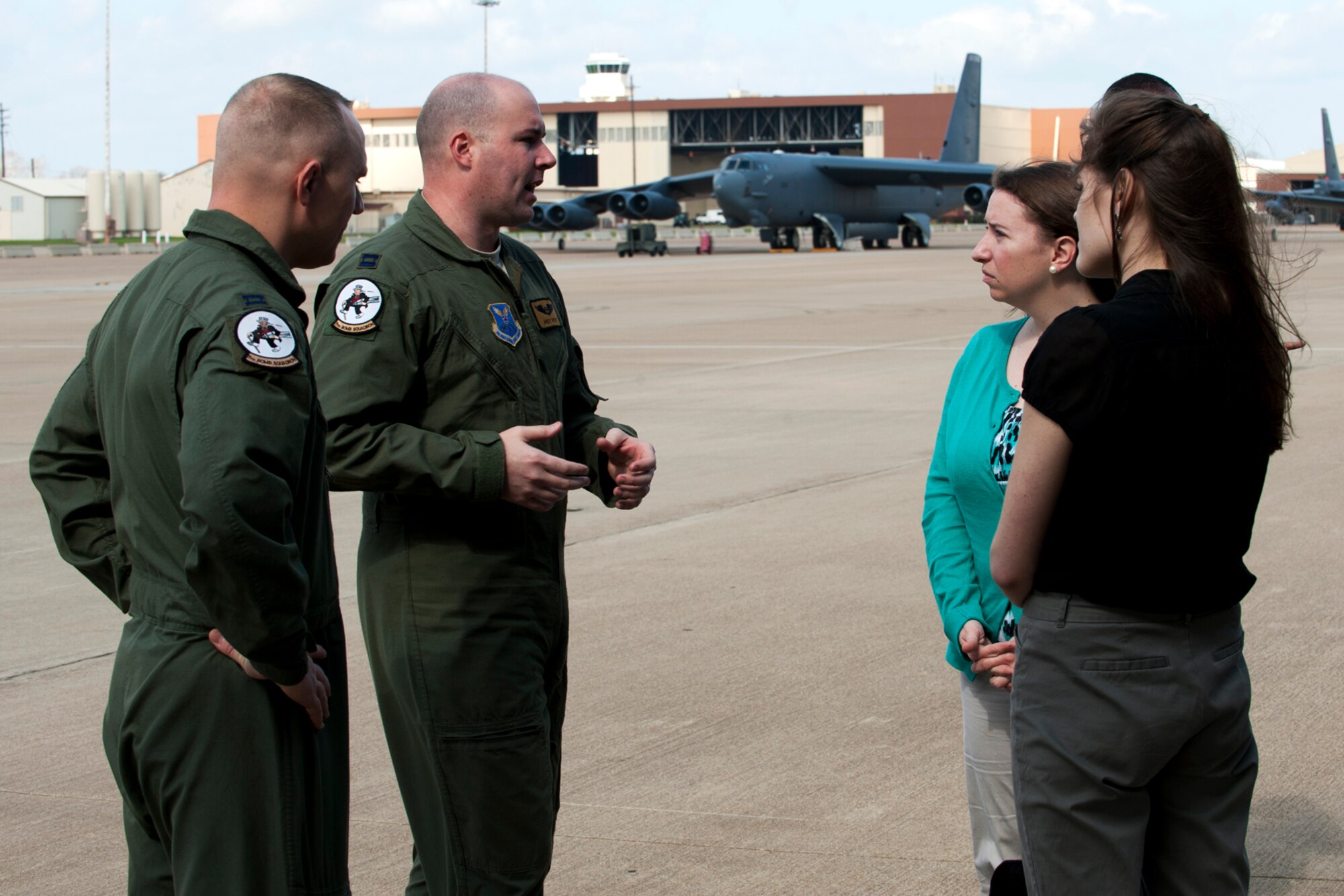 U.S. Air Force Capt. Andrew Riepe, 11th Bomb Squadron B-52 aircrew member, talks to Congressional Staff Delegates Wendy Gnehm and Sierra Forbes during a tour at Barksdale Air Force Base, La., Feb. 22, 2012. The delegates were given a tour of a B-52 with aircrew on hand to answer questions about the aircraft's capabilities. (U.S. Air Force photo by Master Sgt. Greg Steele/Released)