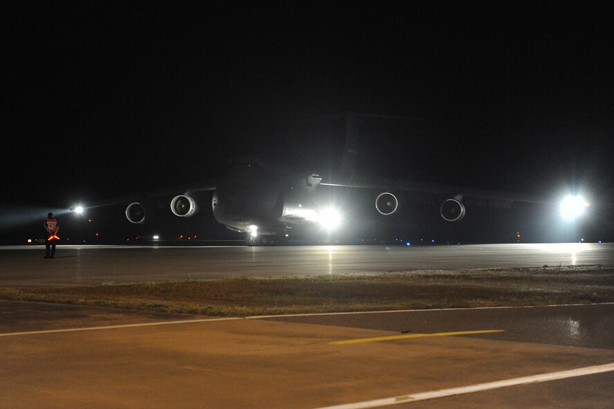 A C-5 Galaxy taxies in at Moody Air Force Base, Ga., Feb. 22, 2012. The aircraft carried
Airmen of the 723d Aircraft Maintenance Squadron returning from a six-month deployment to Afghanistan. (U.S. Air Force photo by Staff Sgt. Ciara Wymbs/Released)
