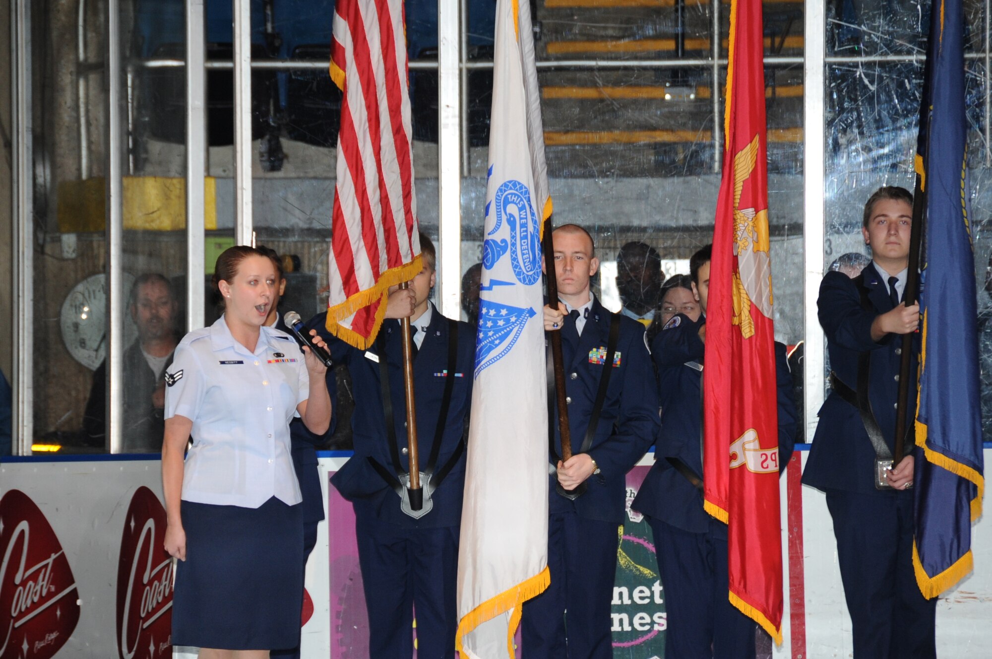 Airman 1st Class Amanda Nesbitt, 81st Contracting Squadron, Keesler Air Force Base, Miss., sings the national anthem for the Mississippi Surge professional hockey game Feb. 18, 2012, at the Mississippi Coast Coliseum.  The Mississippi Surge also honored the military by designating the night as Military Appreciation Night and wearing special camouflage jerseys.  (U.S. Air Force photo by Kemberly Groue)
