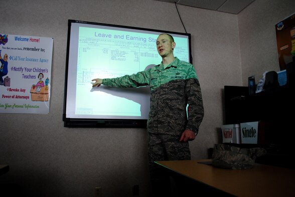Tech. Sgt. Keelan Rasmusson, 319th Comptroller Squadron flight chief of financial analysis, points to the remarks section of a sample leave and earning statement for a service member.  Rasmusson presented a briefing and answered questions about military pay and entitlements during one of the educational and informative events during the first day of Military Saves Week, which took place Feb. 21, 2012, at the Airman and Family Readiness Center at Grand Forks Air Force Base, N.D. (U.S. Air Force photo/Senior Airman Luis Loza Gutierrez)
