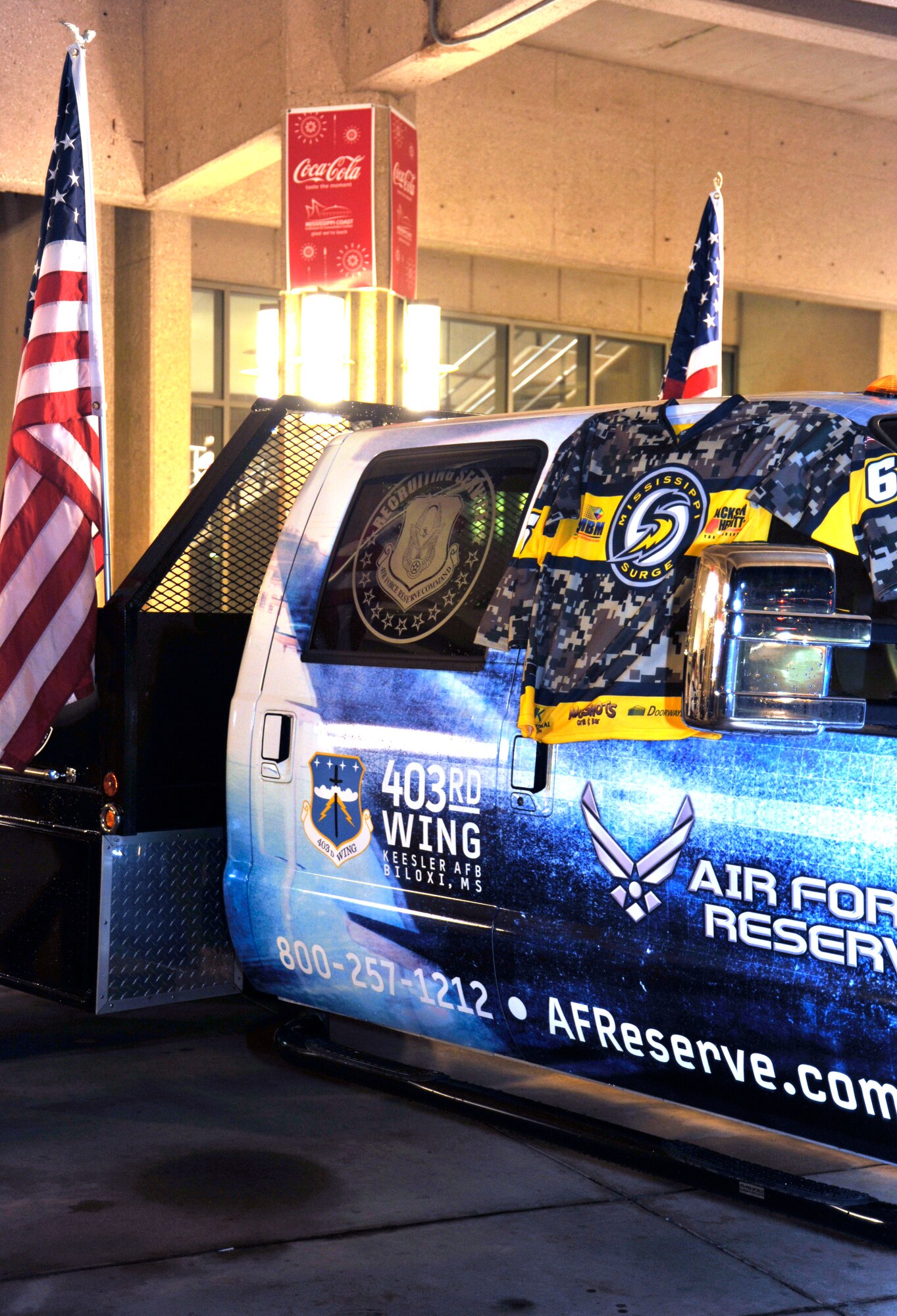 Military members and their families from along the Gulf Coast were treated to military appreciation night at the Mississippi Surge hockey game Feb. 18 when they took on the Pensacola Ice Flyers. The 403rd Wing Recruiting Service served as a game sponsor and displayed the game jersey the Wing received as a 'thank you' from the Surge. The Surge presented the jersey right off the back of one of it's players, Christian Kuqali, at the conclusion of the third period. (U.S. Air Force photo by Maj. Heather Newcomb)