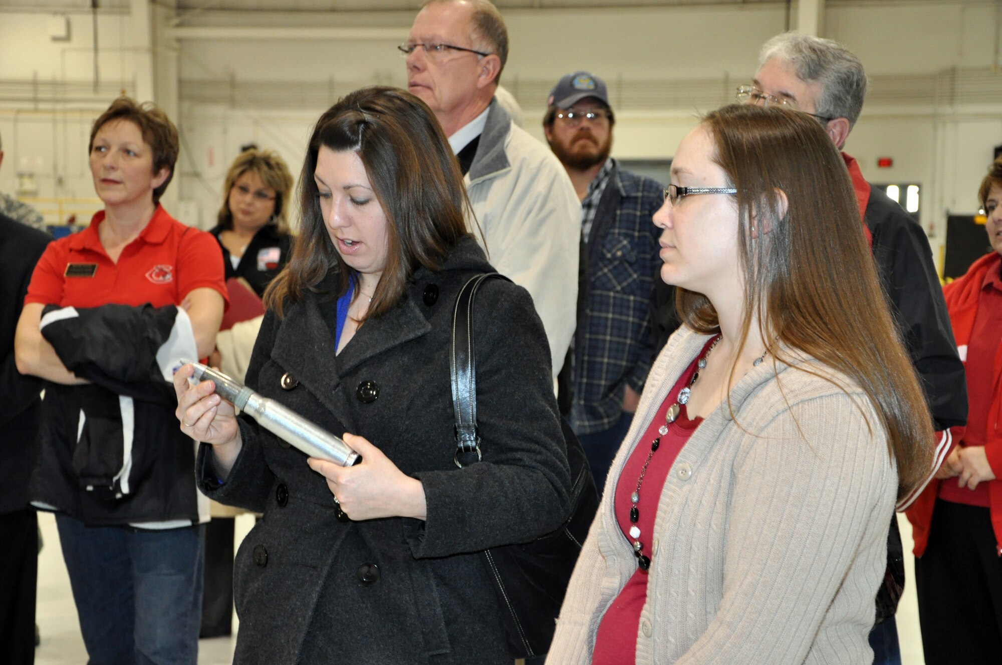 Two faculty members from the University of Central Missouri, Warrensburg, Mo., examine a dummy 30mm round during a briefing on the A-10 Thunderbolt II. UCM faculty members toured the 442nd Fighter Wing at Whiteman Air Force Base, Mo. Feb. 17, 2012. The 442nd Fighter Wing is an A-10 Thunderbolt II Air Force Reserve unit at Whiteman Air Force Base, Mo. (U.S. Air Force photo/Senior Airman Wesley Wright)