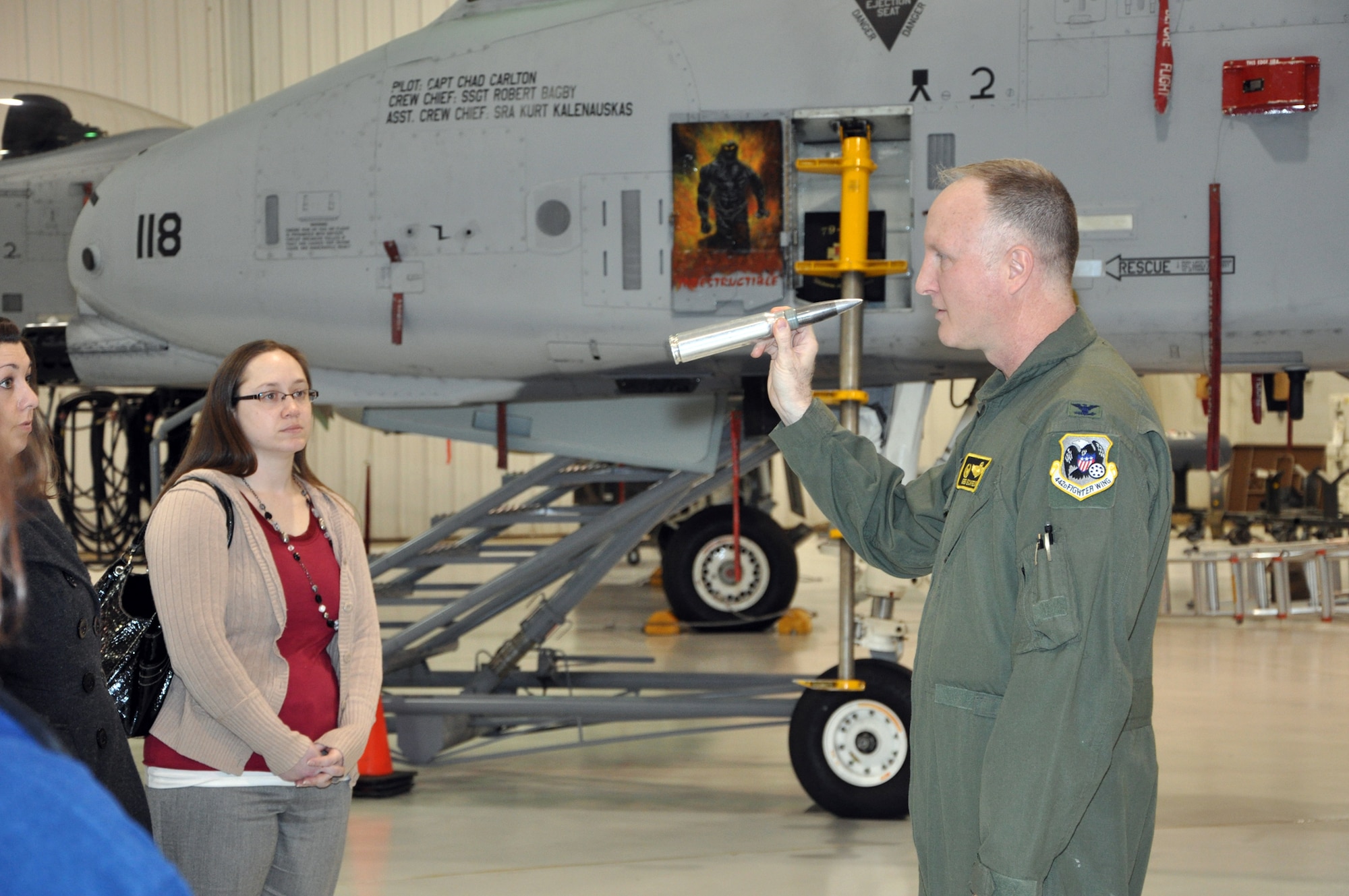 Col. Gregory Eckfeld, 442nd Fighter Wing vice commander, displays a dummy 30mm round during a briefing on the A-10 Thunderbolt II. University of Central Missouri, Warrensburg, Mo., faculty members toured the 442nd Fighter Wing at Whiteman Air Force Base, Mo. Feb. 17, 2012. The 442nd Fighter Wing is an A-10 Thunderbolt II Air Force Reserve unit at Whiteman. (U.S. Air Force photo/Senior Airman Wesley Wright)