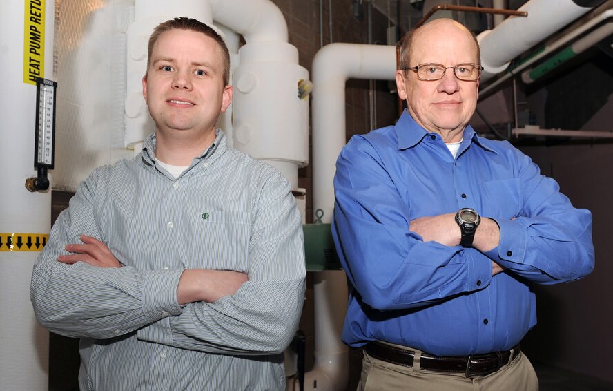 MINOT AIR FORCE BASE, N.D. -- Jason Webster, 5th Civil Engineer Squadron energy manager, and contractor Larry Johnson, 5th CES resource efficiency manger, are part of the team responsible for overseeing energy consumption and establishing projects for facility energy reduction. The duo is entrusted to ensure Minot Air Force Base manages its energy efficiently and effectively. (U.S. Air Force photo/Senior Airman Jose L. Hernandez)

