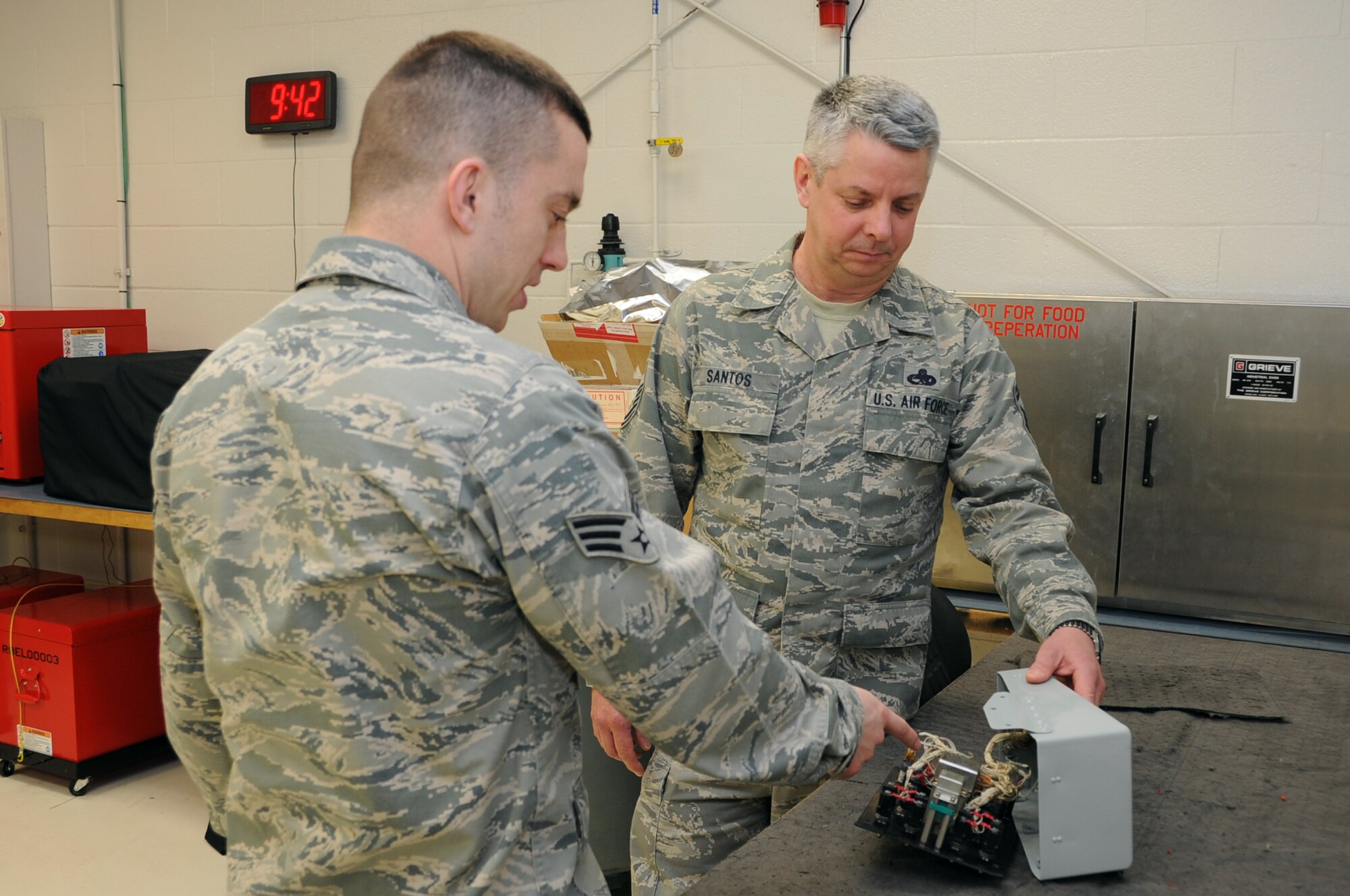 Senior Master Sgt. Roy Santos (right), 442nd Maintenance Squadron Accessory Flight chief, was the recipient of the Lt. Gen. Leo Marquez award for aircraft maintenance supervisor of the year for 2011. The Marquez award recognizes both military and civilian personnel who manage, or directly provide, maintenance for aircraft, munitions or missiles. Santos was nominated by Capt. Robert Mehan, 442nd Aircraft Maintenance Squadron commander. Capt. James Chevalier, 442nd Maintenance Squadron operations officer, was the recipient of the Marquez award for company grade manager of 2011. Tech. Sgt. Paul Hanson, 442nd Aircraft Maintenance Squadron avionics technician, received the Marquez award for technical supervisor of 2011. Chevalier and Hanson are deployed in support of overseas operations. The 442nd Fighter Wing is an A-10 Thunderbolt II Air Force Reserve unit at Whiteman Air Force Base, Mo. (U.S. Air Force photo/Staff Sgt. Lauren Padden)