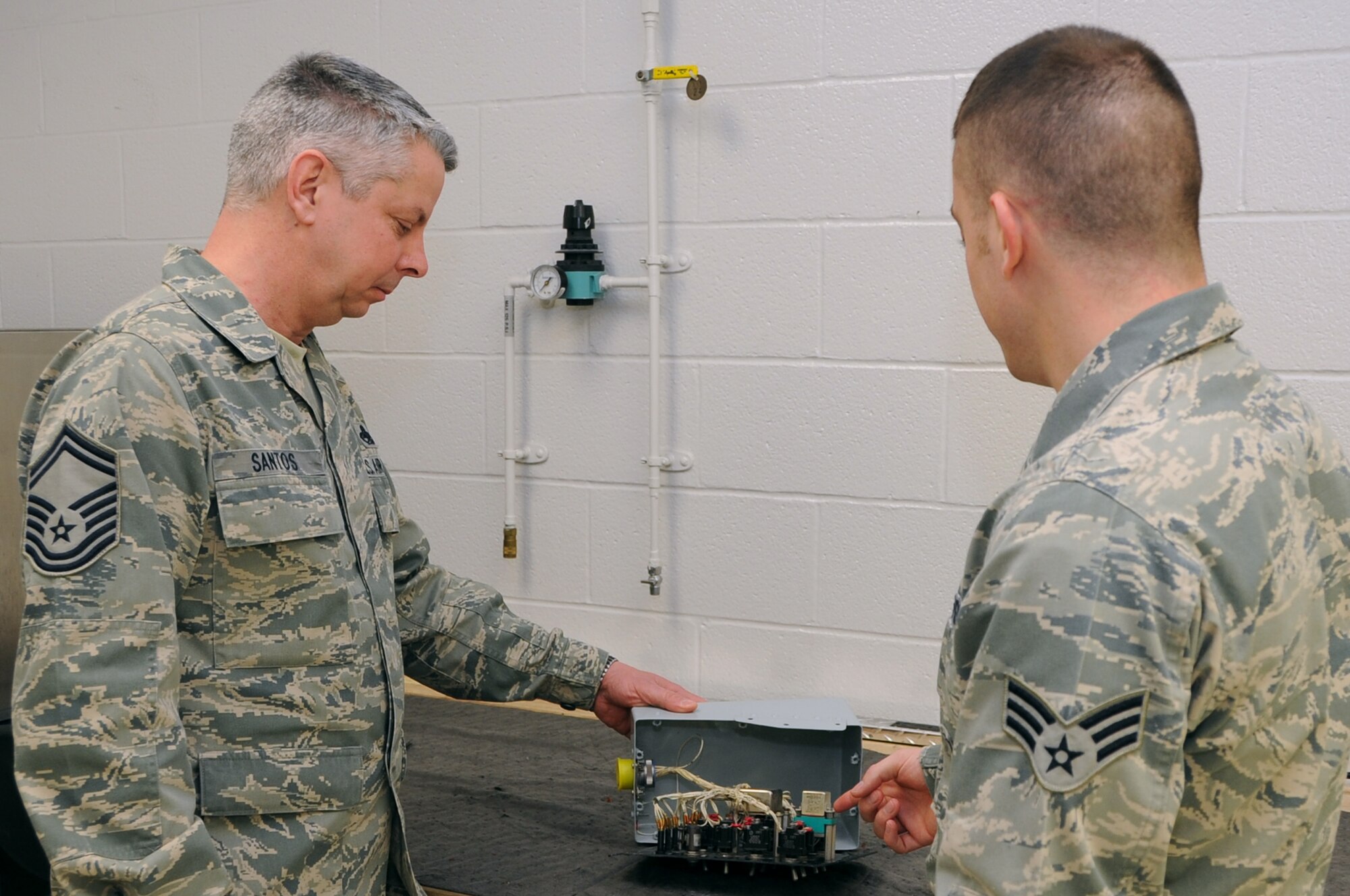 Senior Master Sgt. Roy Santos (left), 442nd Maintenance Squadron Accessory Flight chief, was the recipient of the Lt. Gen. Leo Marquez award for aircraft maintenance supervisor of the year for 2011. The Marquez award recognizes both military and civilian personnel who manage, or directly provide, maintenance for aircraft, munitions or missiles. Santos was nominated by Capt. Robert Mehan, 442nd Aircraft Maintenance Squadron commander. Capt. James Chevalier, 442nd Maintenance Squadron operations officer, was the recipient of the Marquez award for company grade manager of 2011. Tech. Sgt. Paul Hanson, 442nd Aircraft Maintenance Squadron avionics technician, received the Marquez award for technical supervisor of 2011. Chevalier and Hanson are deployed in support of overseas operations. The 442nd Fighter Wing is an A-10 Thunderbolt II Air Force Reserve unit at Whiteman Air Force Base, Mo. (U.S. Air Force photo/Staff Sgt. Lauren Padden)